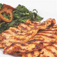 Grilled Chicken Breast · With sautéed broccoli rabe.