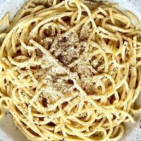 Cacio E Pepe · Spaghetti tossed in Black Pepper and Fresh Parmesan Reggiano.