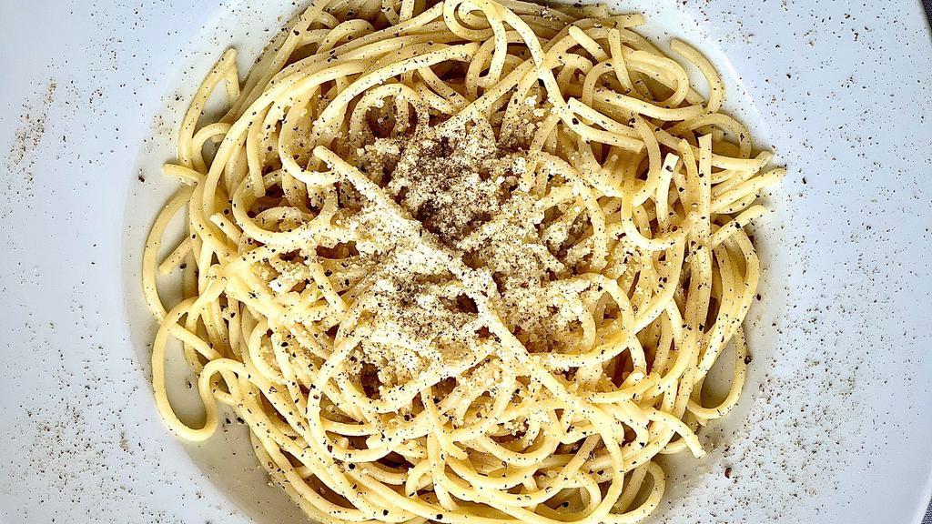 Cacio E Pepe · Spaghetti tossed in Black Pepper and Fresh Parmesan Reggiano.