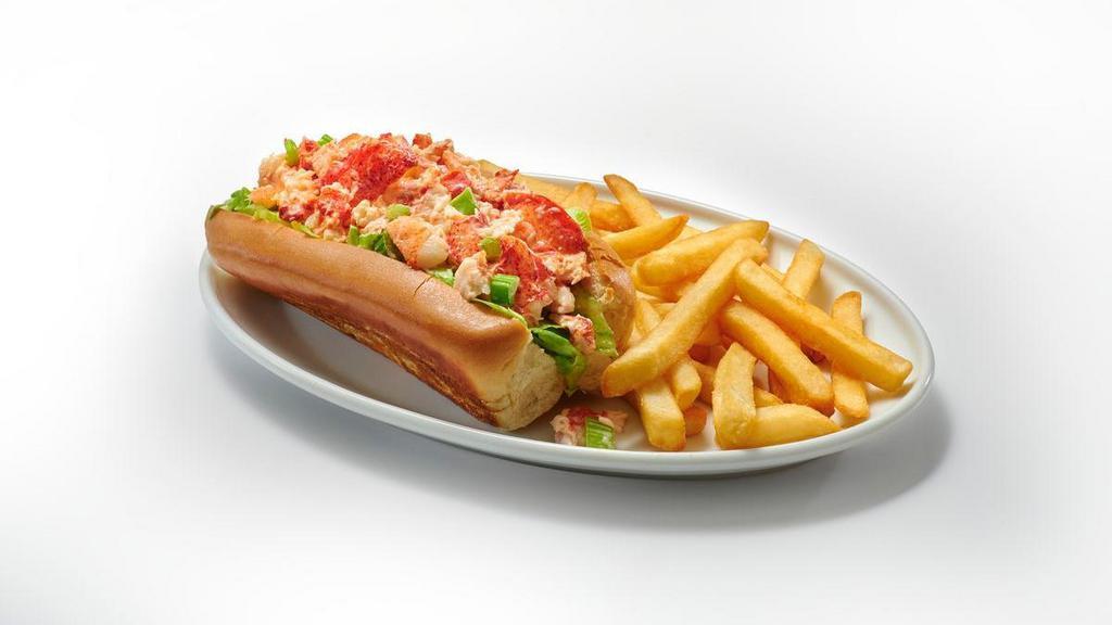 Lobster Roll Classic · Get ready to roll. Lobster Roll, that is. Enjoy our fresh and creamy lobster salad with celery and crisp lettuce on a classic grilled roll with a side of golden fries. Add coleslaw for an extra charge.