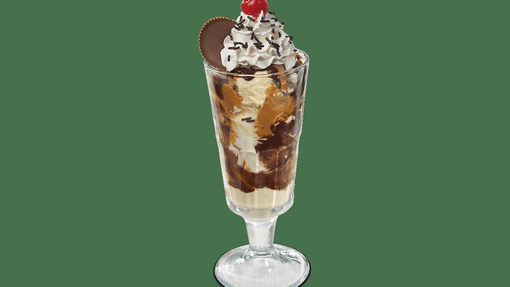 Reese'S® Peanut Butter Cup Sundae · Peanut buttery goodness.  Vanilla ice cream, peanut butter topping, hot fudge, sprinkles, and topped with a Reese's® Peanut Butter Cup.