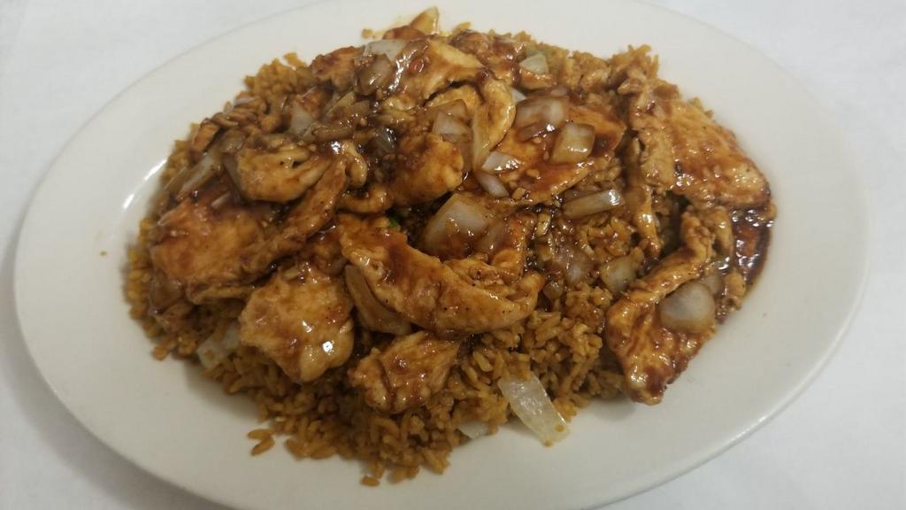 Spicy Boneless Chicken Fried Rice · Boneless chicken in spicy sauce on top of fried rice.