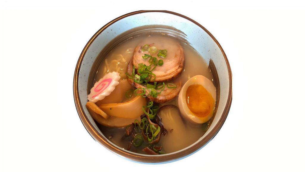 Tonkotsu Ramen · Pork based Japanese Ramen with pork belly slices, kikurage, menma, soft boiled egg and scallion.