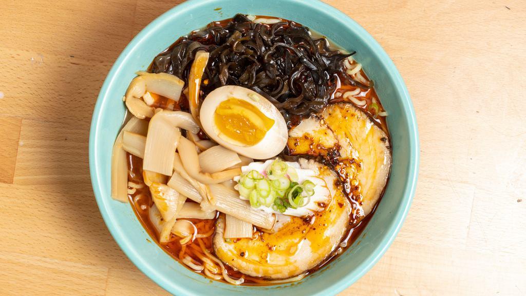 Spicy Miso Ramen · Spicy miso based Japanese Ramen with pork belly slices, kikurage, menma, soft boiled egg and scallion.