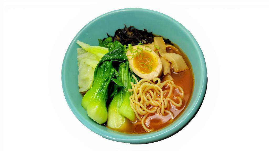 Veggie Ramen · Tomato soup based Japanese Ramen with kikurage, menma, cabbage, scallion and soft boiled egg.