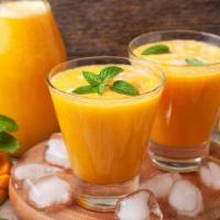 Tropical Juice · Fresh squeezed oranges blended with sweet mangoes.