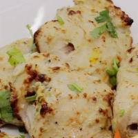 Malai Tikka Lasooni · Boneless cubes of chicken marinated in a paste of garlic, cream cheese, herbs, spices and br...