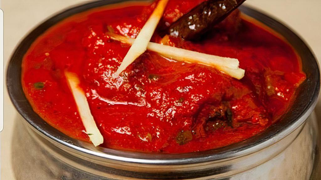 Lamb Vindaloo · Very spicy. Vindaloo is a Portuguese influence on Indian cuisine, vin, and alho meaning vinegar and garlic in Portuguese. A delicacy of Goa, it is prepared with cumin seeds, red chili, cloves, cinnamon sticks, peppercorns, star anise, tamarind, ginger, garlic, and vinegar.