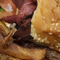 Pastrami Burger · Our freshly made pastrami on top of burger smothered with sauteed onions and melted provolon...