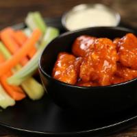 Boneless Classic Buffalo · 8 boneless wings tossed in classic buffalo (medium heat), served with carrots & celery and a...