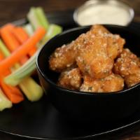 Boneless Garlic Parmesan · 8 boneless wings tossed in garlic parmesan (mild heat), served with carrots & celery and a d...