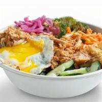 Korean Bbq Pork Warm Rice Bowl · Purple rice, kimchi, cucumbers, spicy broccoli, carrots, sriracha sprouts, fried egg, slow-r...