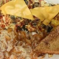 Italian Omelet · Stuffed with mushrooms, sausage, cheese, and tomatoes. With Toast