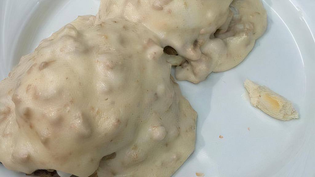 Country Benedict · poached eggs on English muffin with country sausage gravy