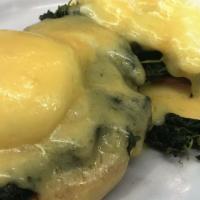 Eggs Florentine · 2 poached eggs on an english muffin with spinach and topped with hollandaise sauce.