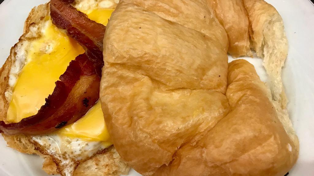 Breakfast Croissant Sandwich · Fried egg, bacon and cheese on a grilled croissant.