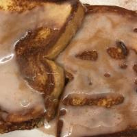 Cinnamon Glaze French Toast · Two huge slices of of cinnamon bread dipped in egg batter, grilled and drizzled with a cinna...