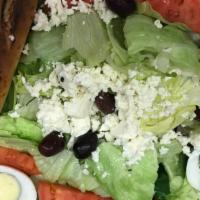 Large Greek Salad · Fresh greens, olives, Feta cheese, egg and tomato with our special greek dressing and a fres...