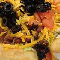 Chili Taco Salad · A crispy taco shell filled with lettuce and fixed your way.