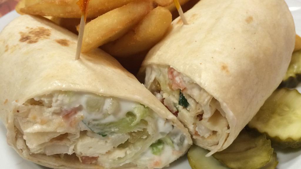 Chicken Ranch Wrap · Breaded chicken tenders stuffed with lettuce, tomato, cheddar cheese and tossed in a ranch dressing
