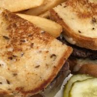 Swiss Burger · on grilled rye bread with Swiss cheese and sauteed onions
