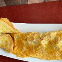 American Omelette · Eggs,  bacon, ham, cheese, honey and toasted bread.