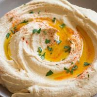 Hummus · Chickpeas with sesame sauce, lemon juice, tahini sauce & olive oil. Add an additional charge...