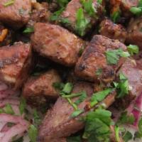 Lamb Liver · Fried liver cubes served with onions.