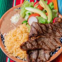 Carne Asada Plate · Grilled marinated steak. Served with rice, beans and salad.