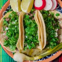 Azteca Taco · 3 to an order suited steak grilled cactus suited onions topped with cilantro radishes lime w...