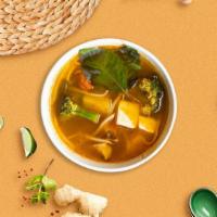Tom Yum Elegance · Spicy clear soup base with lemongrass, lemon leaf, mushroom, cilantro and chili.