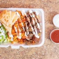 Mixed Plater (Chicken & Lamb) · Delicious chicken and lamb platter served with rice, salad , pita bread & your choice of sau...