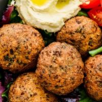 Falafel Hummus Salad
 · Delicious hand tossed salad. Served with juicy delicious fresh falafel with lentils on top w...