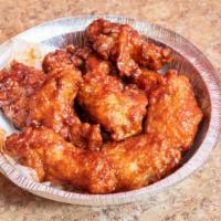 Chicken Wings · Comes with 6 Jumbo party  wings. Available in Hot, Mild, Barbecue, Plain, Garlic, or Lemon p...