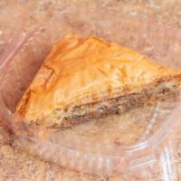 Baklava · A dessert originating in the Middle East made of phyllo pastry filled with choppedbnuts and ...