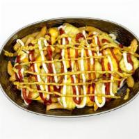 Signature Fries · Ketchup, mayo, mustard, pickles and cheese sauce