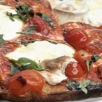 Chunky Grandma · Brooklyn style pan pizza, fresh mozzarella, topped with house marinara, cherry tomatoes, par...