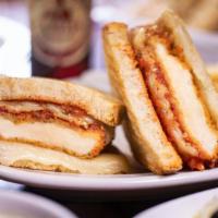 Chicken Parmigiana Panini · Grilled Panini Sandwich made on a European Flatbread, and topped with Breaded chicken, mozza...