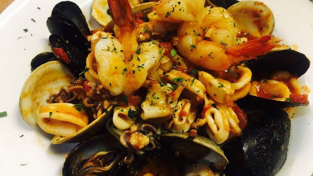 Linguine Pescatore · Shrimp, clams, calamari, and mussels in light marinara sauce.