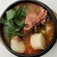 Gam Ja Tang · Potato and back bone of pork with vegetables and ground perilla in spicy broth.