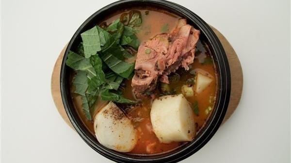 Gam Ja Tang · Potato and back bone of pork with vegetables and ground perilla in spicy broth.