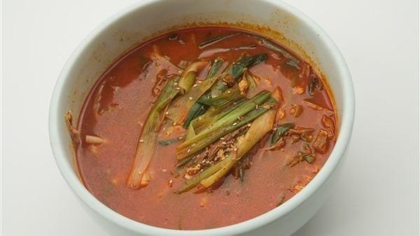 Yook Gae Jang · Spicy soup with shredded beef and scallion.