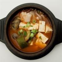 Den Jang Chi Gae · Bean paste stew with bean curd, vegetables, seafood.