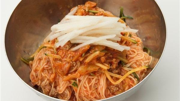 Bi Bim Kook Soo · Cold, spicy. Korean style noodles with chopped vegetables and beef, pears in spicy sauce.