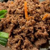 Bul Go Ki · Thin sliced tender beef marinated in special soy sauce.