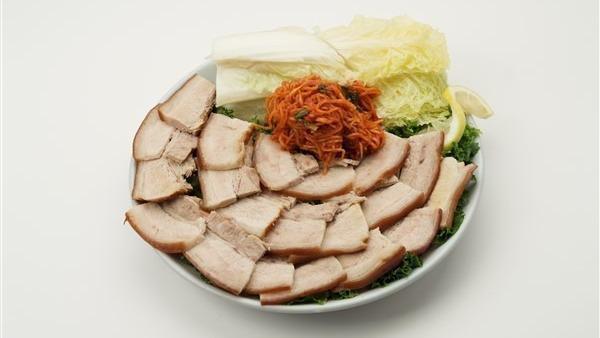 Jhim Sam Gyb Sal · Steamed pork belly and salted sliced cabbage with spicy shredded radish.