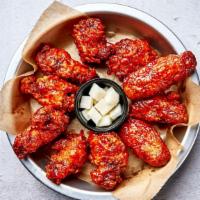 Korean Hot Spicy Wings · Bell & Evans wings fried in our special olive oil blend and painted with our umami soy garli...