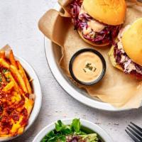 Two Korean Spicy Fish Sliders Combo · Two sweet and spicy montauk fish sliders with sweet potato fries and side salad.