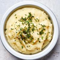 Parmesan Mashed Potatoes · Creamy and velvety Idaho mashed potatoes with freshly grated parmesan cheese and chives.