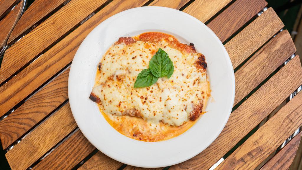 Pollo Parmigiana · Chicken Cutlet, Tomato Sauce, Homemade Mozzarella, Parmigiano Reggiano